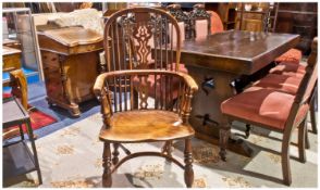 A Fine Quality High Back Yew Wood Windsor Armchair with crinoline stretcher on finely turned legs.