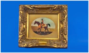 A Gilt Framed Oilograph of a man on horseback. Size 16 x 14 inches.