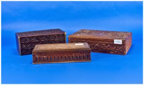 Three Various Carved Wood Cigar/ Cigarette/ Trinket Boxes comprising one with hand carved stylised
