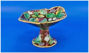 Majolica Comport  with leaf design, 12 inches high, 7 inches in width. Unmarked.