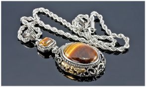 Tigers Eye Pendant Necklace, a large oval tiger eye cabochon in an openwork setting with gold