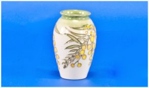 Moorcroft Small Vase ``Mimosa`` Yellow Pattern, on green and cream ground. Height 4.25 inches.