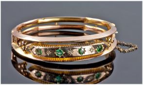 Edwardian 9ct Gold And Emerald And Diamond Set Open Work Bangle, with safety chain. Hallmark