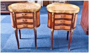 Pair of French Kidney Shaped Side Cabinets with marble tops and gilt metal friezes to the edges.