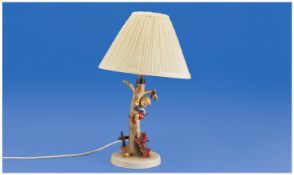 Hummel Figural Lamp. Boy climbing a tree, small dog in pursuit. Mark to base. Stands 16.5 inches