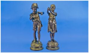 French Austrian Copper Bodied Cast Pair of Delightful Figures of a boy in a hat and tyrolean dress