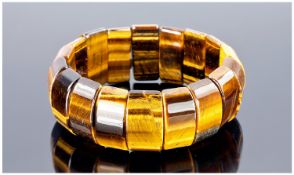 Tiger Eye Bangle Type Bracelet, a large carat weight of the semi-precious, golden to warm brown