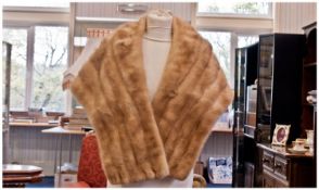 Warm Golden Blonde Mink Short Stole, fitted to the shoulders with a narrow shawl collar, loose to