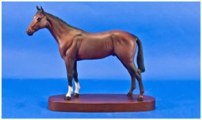 Royal Doulton Beswick Horse Figure. Raised on wooden plinth. 8 inches high.