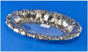 A Good Silver Plated Oval Serving Dish with raised and richly embossed sides. 12 inches long.