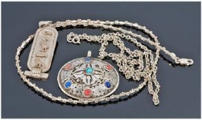Two Silver Chains and Two Silver Pendants. 1) An Italian silver chain/necklace of unusual segment