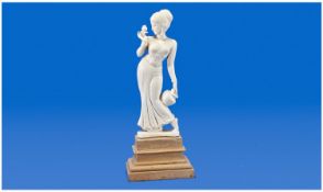 Indian Ivory Figure of a Young Woman of Shapely Form Holding a Exotic Flower in Her Right Hand.