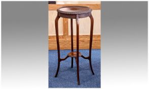 Edwardian Mahogany Plant Pot Stand with a round tray top with carved rope edge, supported by four