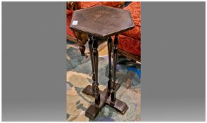 Ebonised Candle Type Side Table with hexagonal top, on four turned legs on platform base. 25 inches