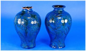 C.H.Brannam Barum Pair of Exotic Bird Vases, each baluster vase having sgraffito decoration of