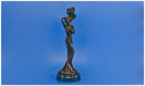 A 20th Century Signed Bronze Figural Candle Holder, in the form of an art nouveau style young woman