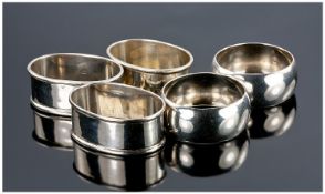 A Three Piece Matched Set Of Silver Napkin Holders, of plain form. All holders marked, 47.7 grams.