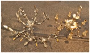 A Pair of Brass Dutch Style Chandeliers. One with silver plated and another with brass finish. Five