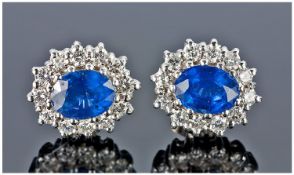 A Fine Pair Of 18ct Gold Set Sapphire And Diamonds Earrings. The sapphires are of good colour, each