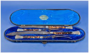 Elkington & Co. Four Piece Carving Set. The handles of tortoiseshell style with embossed silver end