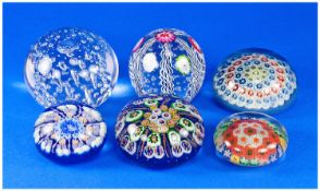 A Collection Of Six Scottish Paperweights. Miliflora, canes and bubble decorations. Various shapes