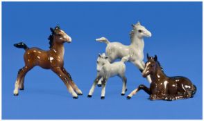 Beswick Foal Figures, 4 in total, 1. Foal Grey Small Gambulling Left, Model 996, 3.25`` in height.