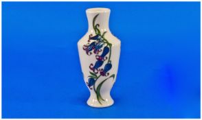 Moorcroft Modern Small Vase `Blue Bells`, on cream ground. Date 2009. Stands 6 inches high.