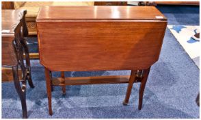 Edwardian Mahogany Inlayed Sutherland Table on splayed out legs with slatted ends. Cross banding to