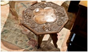 Indian Carved Teak Side Table. Profusely carved top with floral decoration, on a four leg