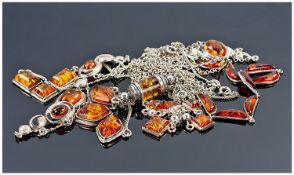 Collection Of 7 Amber Coloured Silver Pendant Necklaces.