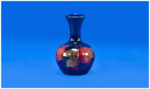 Moorcroft Miniature/Small Vase `Pomegranate` Design, on blue ground. Circa 1920`s. Height 3.75