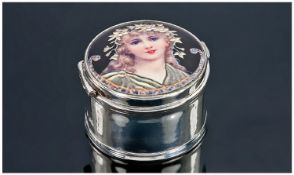 A Silver and Enamel Box. The round hinged lid beautifully enamelled with a Pre-Raphaelite maidem (