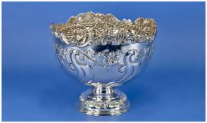 A Silver Rose Bowl with embossed floral decoration and scroll work to body. The borders with scroll