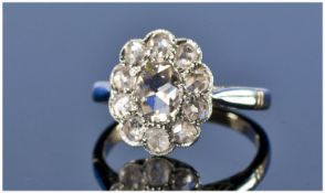 Early Victorian 18ct Gold Set Diamond Cluster Ring, Flowerhead Setting. The central stone diamond