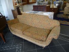 Edwardian Style Three Seater Settee, with a fully upholstered back and seat, raised on turned feet.