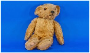 Well Loved Teady Bear. Glass eyes, originally a growter. Worn.