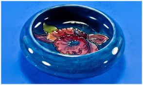 Moorcroft Inverted Small Bowl ``Orchids`` Design, on light blue ground. c.1960`s. 4.5 inches