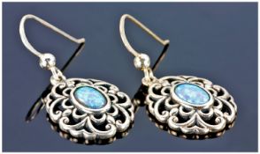 Pair Of Silver Open Work Drop Earrings The Centres Set With Oval Opal Coloured Stones.