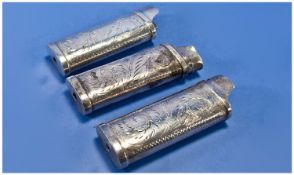 Vintage Silver Lighter Cases With Chased Decoration, 3 in total. Each marked 925. Each 3 1/8 inches