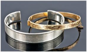Silver Bangle With Moulded Edge And Reeded Design, Stamped 925, Together With A Rolled Gold Bangle.