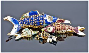 Four Silver Enamelled Articulated Fish Pendants.