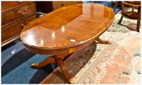 Mahogany Traditional Regency Style Oval Shaped Coffee Table, Raised \On a Four Reeded Shaped Legs,