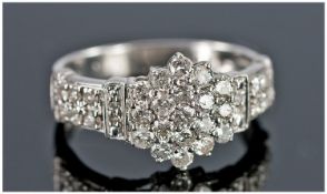 9ct White Gold Set Diamond Cluster Ring. The central flower head setting flanked by diamond