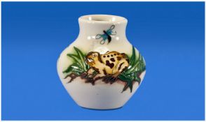 Moorcroft Modern Frogs and Mosquito Small Vase on cream ground. Date 2009. Stands 3.25 inches high.
