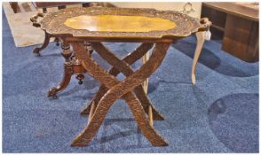 Indian Teak Butlers Tray on Legs, with a shaped tray top with side handles, profusely carved edges