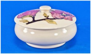 Moorcroft Lidded Powder Bowl `Pink Magnolia` Design, on cream ground. Circa 1970`s. Impressed