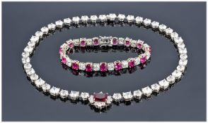 Silver Mounted CZ Necklace With Ruby Coloured Drop Together With A Silver Tennis Bracelet Set With