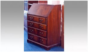 Modern Mahogany Bureau, fall opening to reveal drawers and pigeon holes, over four long graduated