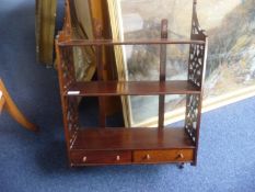 Mahogany Wall Unit, fitted with three shelves, fretwork to sides and two drawers, late 20th