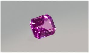 A Fine Unmounted Single Stone Emerald Cut Pink Sapphire. Of good colour & weighs approximately